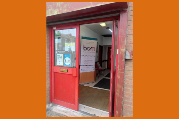 Entrance to Soho Community Hall, with BCM banner